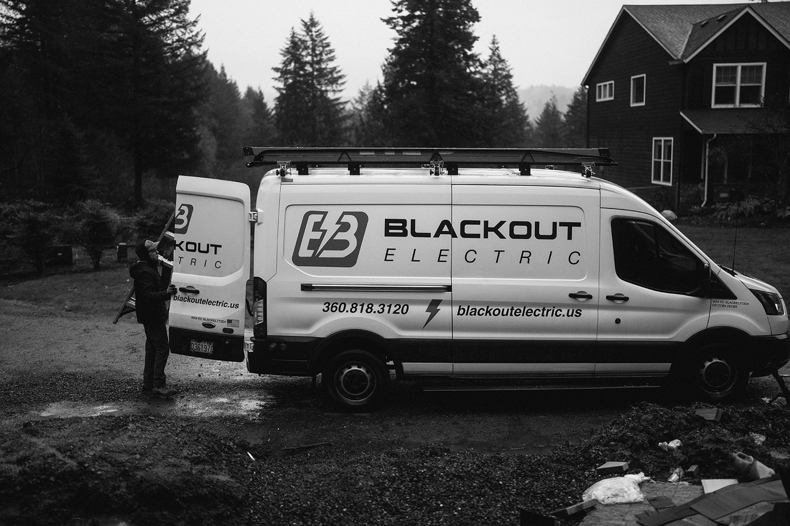 Blackout Electric service van parked outside a residential project.